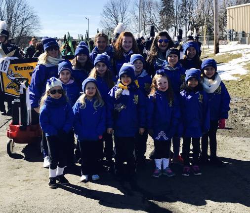 Irish Dancers from the An Clar Irish Dance Studio, in Byram, prepare to march.