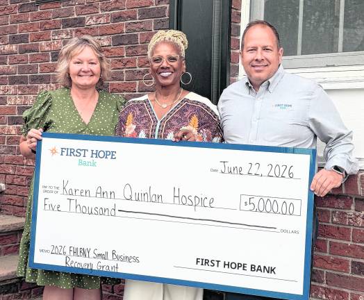 <b>Karen Ann Quinlan Hospice executive director Lee Ellison, center, accepts a check donation from First Hope Bank Senior Vice President Deena Smith and President/Chief Executive Officer/Chairman of the Board Daniel Beatty.</b>