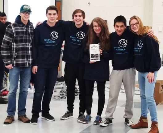 Sparta VEX Robotics Team 5249-Z &#x201c;Endeavour&#x201d; poses victoriously with their Design Award trophy Photo by Mark Meola
