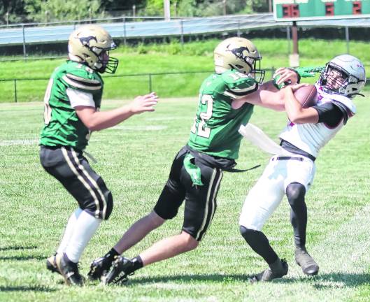 Sussex Tech defender Mason Aumick (12) forces Parsippany quarterback Mason Alameda out of bounds in the third quarter.