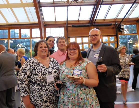 Cheryl Ross, front row left, with her family at a recent event. Ross, a Project Self-Sufficiency board member, successfully nominated Project to receive an award from HSN Cares.