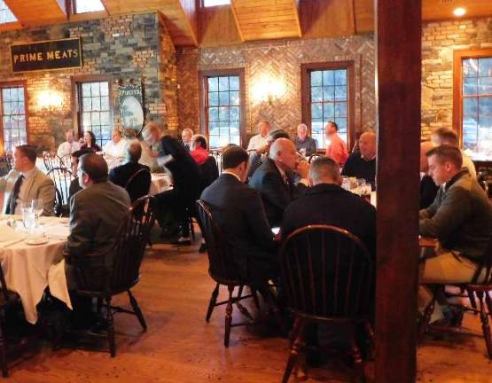 Members of the Sussex County League of Municipalities have conversation over dinner and then watch a film and presentation by disaster and trauma training expert Steve Crimando. Crimando spoke to the league during their dinner meeting held Thursday, Oct. 18, 2018 at the Mohawk House in Sparta. 