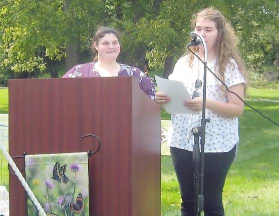 Melanie Trillo and Angela Edson read the names of beloved departed pets (Photo by Janet Redyke)