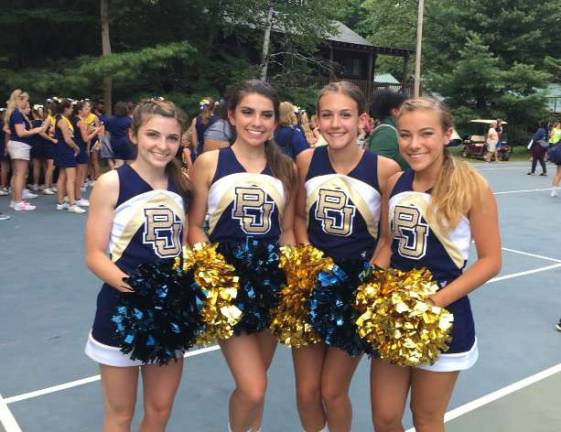 Noelle Newman, third from left, poses for a picture with fellow Pope John juniors Caitlin Hanley, Brianna Hentschel and Olivia Gang after they were named UCA All-American Cheerleaders at the UCA summer camp at Pine Forest in August.
