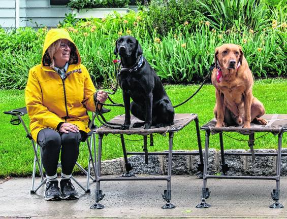 Lisa Barrett sits with her dogs, Susie and Sarge.