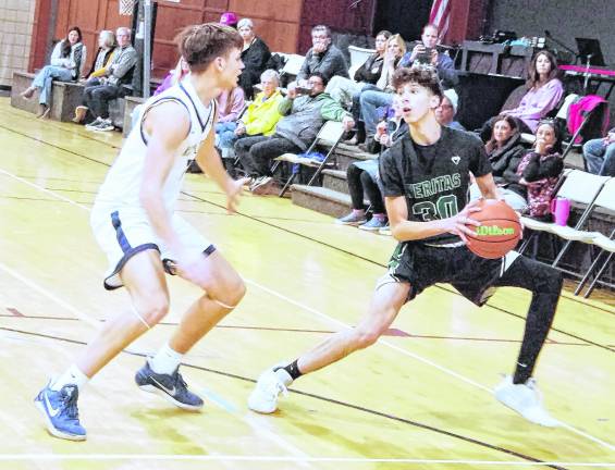 Veritas Christian's Dallas Tanis handles the ball. Tanis scored 8 points.
