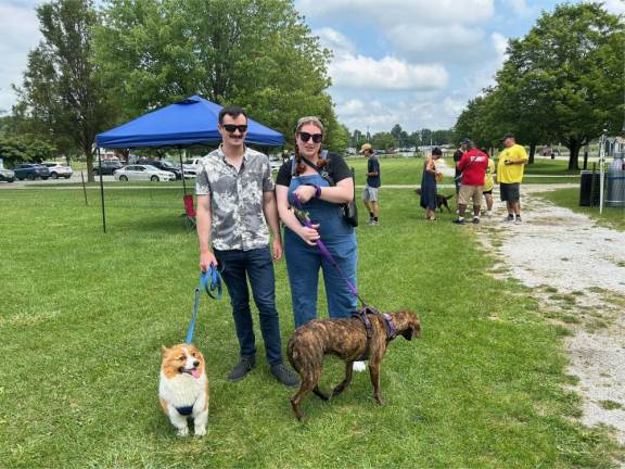 Brian and Shay Powers with their dogs Finn &amp; Sadie. They adopted Sadie at the festival last year through Father John’s Animal House.