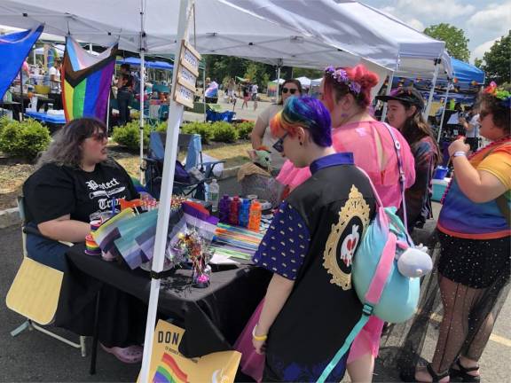 Zoe Heath, left, is founder of Sussex County Pride, which organized the Pride Celebration. Thorlabs of Newton donated money for the event and permitted it to be set up in a company parking lot.