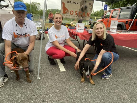 O.S.C.A.R. volunteers Craig Peters of Lake Hopatcong, Cassie Kowalchuk of Bridgewater and Betty Peters, right, of Lake Hopatcong pose with dogs Piper and Charles.
