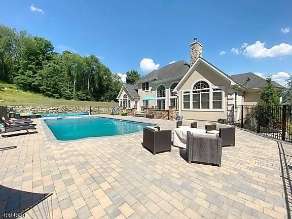 Stunning home with pool and lots of land is the toast of summer