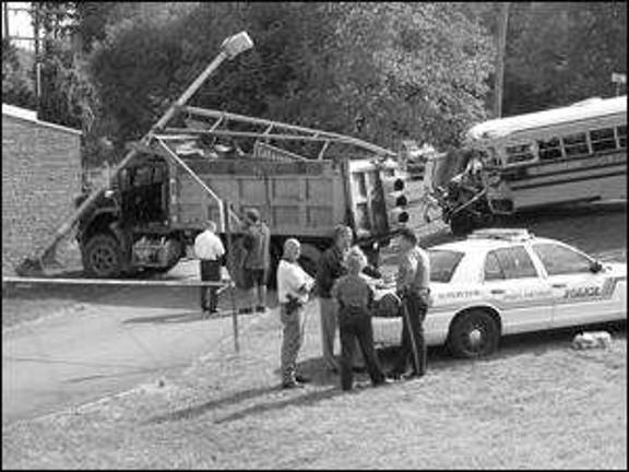 Dump truck collides with school bus