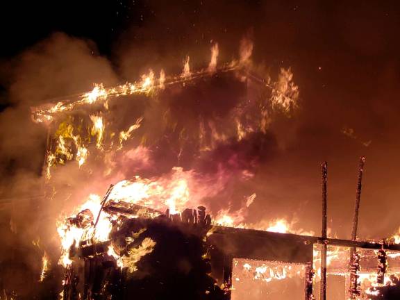 Fire at a Sparta residence on Wednesday morning, Jan. 30, 2019, resulted in total loss of the residence, and a pet is missing, police said. The family members who were home at the time were able to leave the house and are uninjured. (Photo provided by Sparta Police)