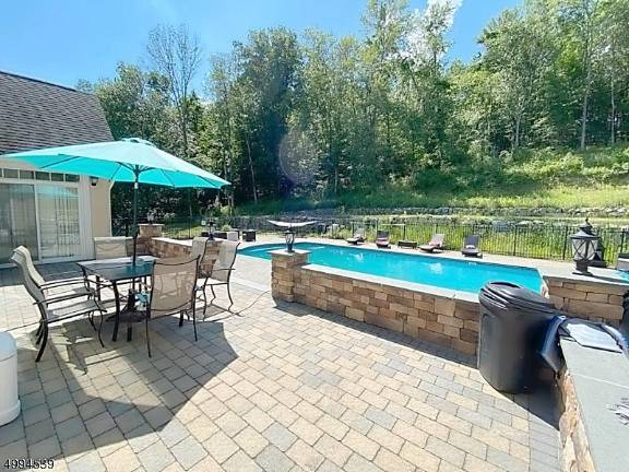 Stunning home with pool and lots of land is the toast of summer