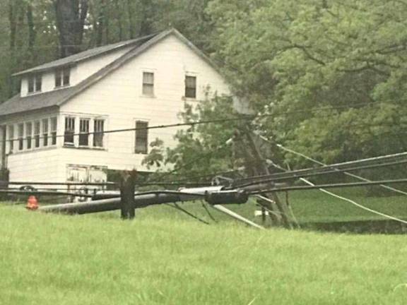 Utility pole cracked and fallen on Route 517