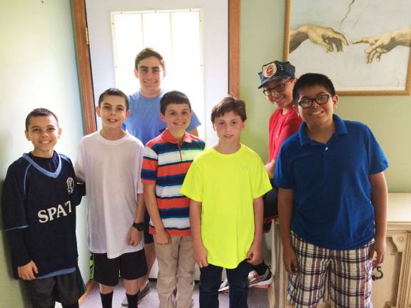 Saint Kateri Squires celebrate following the state elections. From left: Maddox Corbin, Hayden Corbin, Jack Lubertazzi, Charlie Wyckoff, Luke Reilly, Fernando Gomez, and Sebastian Gomez