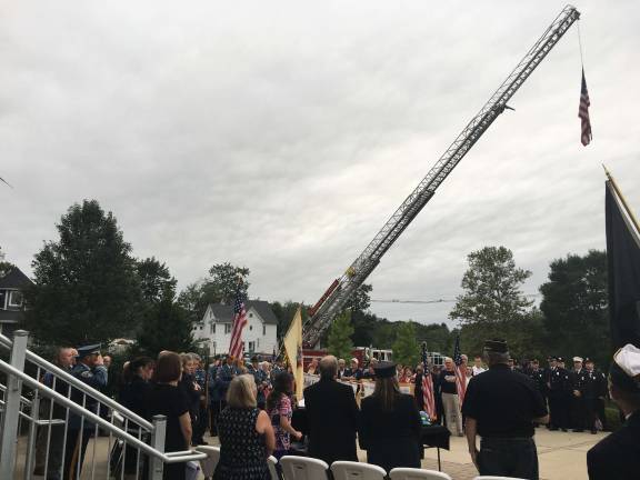 PHOTO BY AMY SHEWCHUK An American flag hovered over the Sparta ceremony.