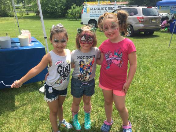 From left: Gianna Arcieri, Cheyenne Turre and Zoey Turre enjoyed face painting and making sand art