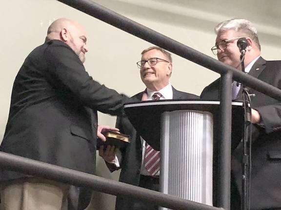 Sussex County Commissioner William Hayden, left, is congratulated by state Sen. Steven Oroho, right, who administered the oath of office to Hayden.