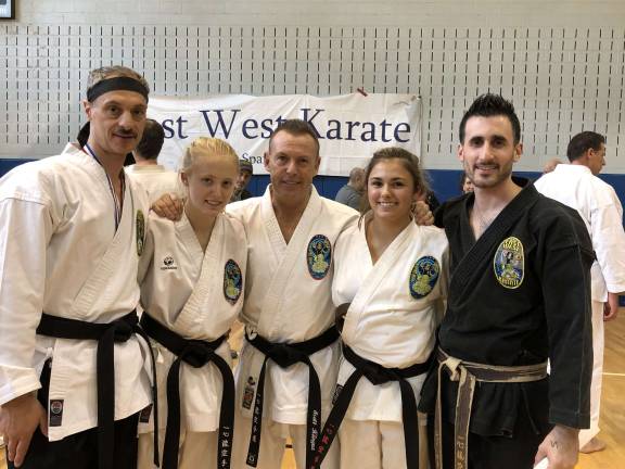 Promoted students celebrate after the spring shiai. From left: John Grassia, Brooke Klinger, Sensei Scott Klinger, Emily Slattery, and Joe Malaro. (Photo provided