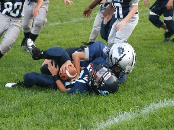 Football fans packed Ungerman Field in Sparta, N.J. on Friday August 30, 2013. Sparta youth teams took on several teams from neighboring towns in exhibition games. The evening also featured a special recognition of military veterans.