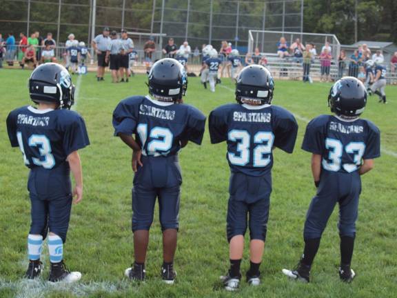 Football fans packed Ungerman Field in Sparta, N.J. on Friday August 30, 2013. Sparta youth teams took on several teams from neighboring towns in exhibition games. The evening also featured a special recognition of military veterans.