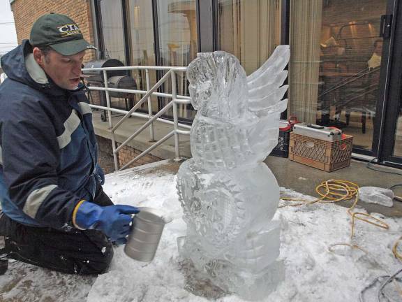 A splash of water adds polish and shine to the sculpture.