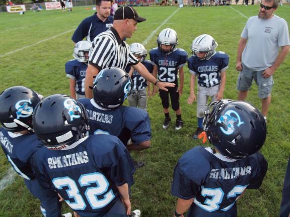 At the coin toss is it heads or tails? Football fans packed Ungerman Field in Sparta, N.J. on Friday August 30, 2013. Sparta youth teams took on several teams from neighboring towns in exhibition games. The evening also featured a special recognition of military veterans.