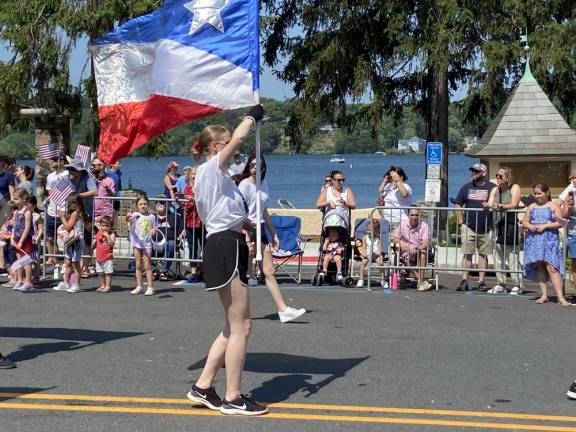 Ella Simmons, 18, of Sparta holds a flag in the parade.