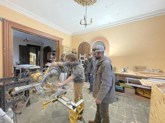 Students in the Building Construction Technology program at Sussex County Community College are instructed by their professor on the proper use of the equipment. (Photos courtesy of Sussex County Community College)