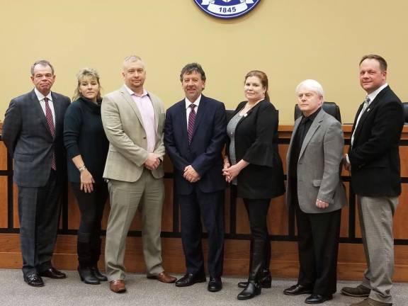 New Sparta Municipal Judge Paris Eliades with township council. From left, Township Manager William Close, Deputy Mayor Chris Quinn, Mayor Josh Hetzberg, Judge Paris Eliades, Councilwoman Molly Whilesmith, Councilman Jerry Murphy and Chief of Police Neil Spidaletto. Photos by Rose Sgarlato