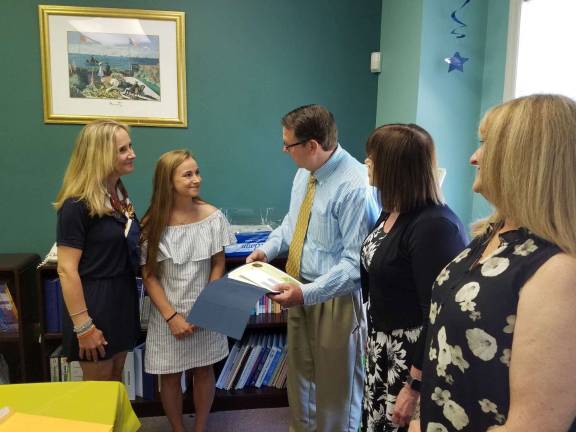 From left, Bridget Sorenson (mother), Alessandra Sturchio, Scott Allshouse (principal), Sue Hackett (director of Education), Sandra Santora (vice principal, supervisor of Curriculum) Photo by Karl J. Venescar