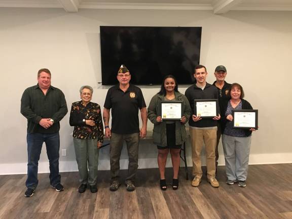 Scholarship ceremony at the VFW. From left: Chris Hayden, Dolores Rojas, VFW Post Commander Pete Litchfield, Mia Francis, Hunter Toburen, Rudy and Celeste Beckmann.