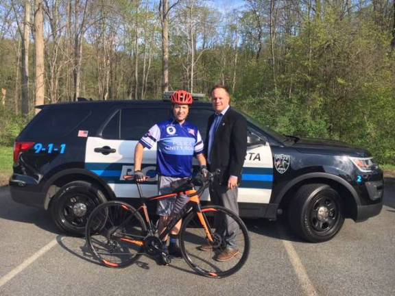Sparta Police Sgt. Rob Fraser in cycling uniform with Sparta Police Chief Neil Spidaletto Photo provided