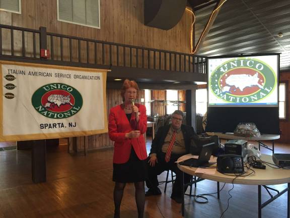 LInda Grinthal of Sparta UNICO and Andre Di Mino of UNICO national give a presentation to attendees at Italian Heritage event.