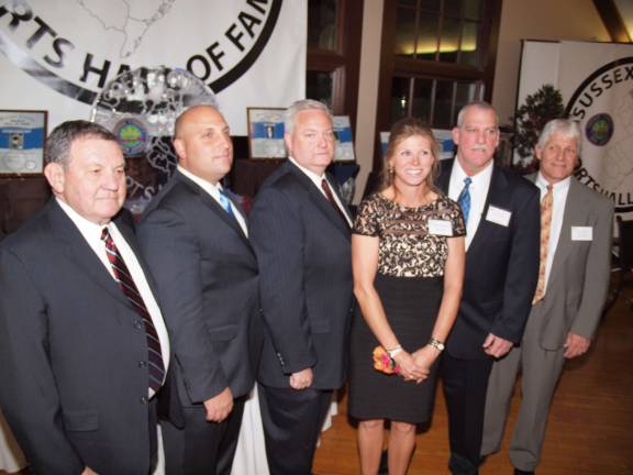 Photos by George LeRoy Hunter Hall of Fame inductees group portrait. From left John Leach, representing his son Mike Leach (Jefferson 1995), Mike Marchiano (Jefferson 1993), Dan Cleary (Vernon 1984), Lee Ann Wyble-Best (Vernon 1992), Hugh Albora ( Pope John 1975) and Gene Taylor (Sparta 1975).