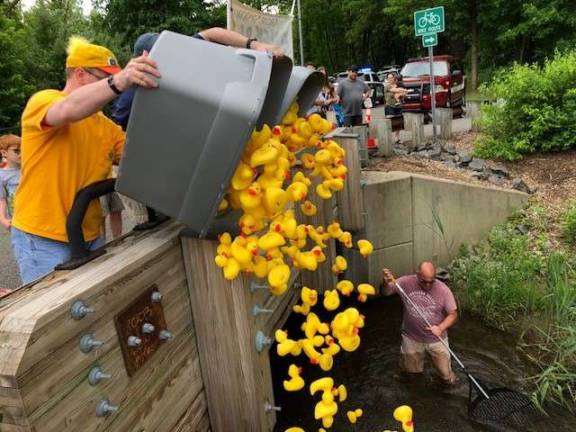 Kiwanis Club members release the rubber ducks into the Wallkill River for the Sparta Day race Photos by Amy Shewchuk
