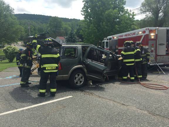 Sparta Fire Department and EMTs demonstrate a car accident extraction using the Jaws of Life