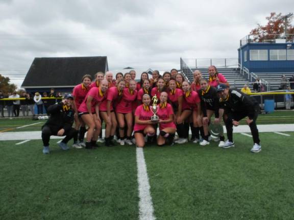 GS4 The 2023 Sparta High School girls soccer team poses with the trophy after winning the Hunterdon/Warren/Sussex Tournament for the first time in school history.