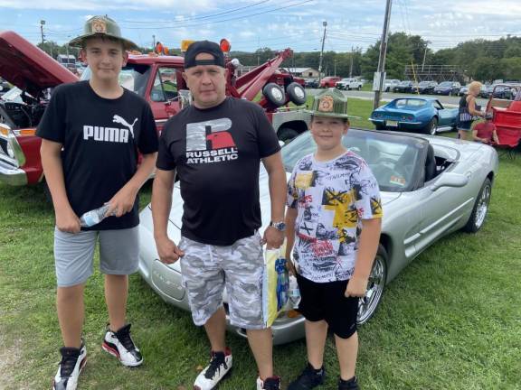 Greg Kraszewski of Vernon and his sons, Albert, 12, left, and Filip, 11, visit the Classic Car Show during Sussex County Day.