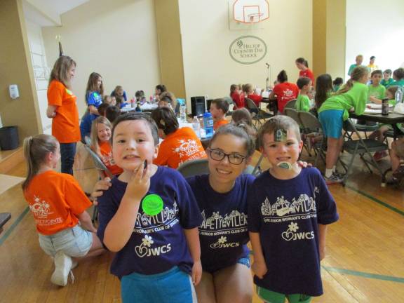 Photos by Laurie Gordon Henry Masterson, Marissa Angelucci and Drew Shepulski prepare for the final singing of the Safety Village theme song last week at the program sponsored by The Junior Woman's Club of Sparta.