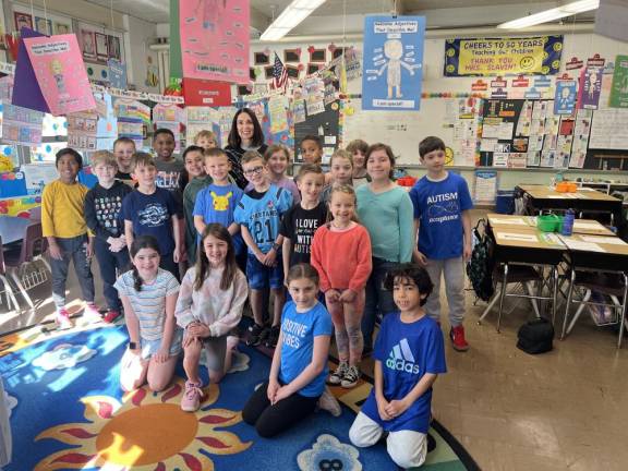 Judith Slavin poses with her students in her second-grade classroom at Alpine Elementary School in Sparta. (Photo provided)