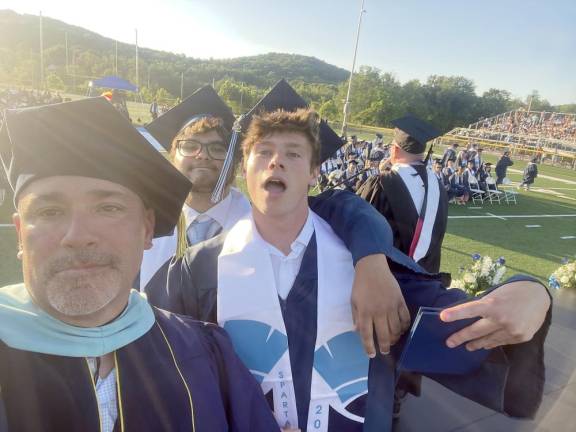 Principal Lazzara takes another selfie with some enthusiastic Class of 2022 grads.