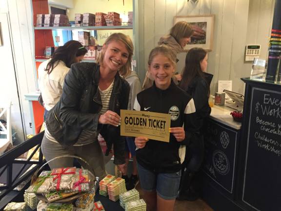 Lucy Franks being presented her &quot;Golden Ticket&quot; by Chloe Dahl, Roald Dahl's granddaughter.The ticket was signed by HRH Camilla Parker-Bowles (the wife of Prince Charles who is a trustee of the Roald Dahl foundation)