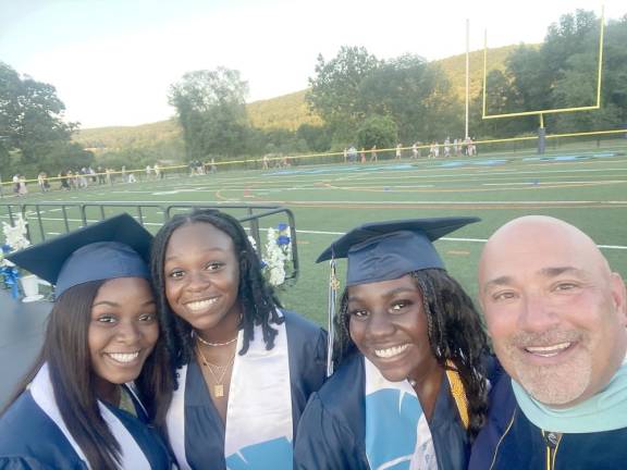 Principal Lazzara takes a selfie with a few happy Class of 2022 grads.