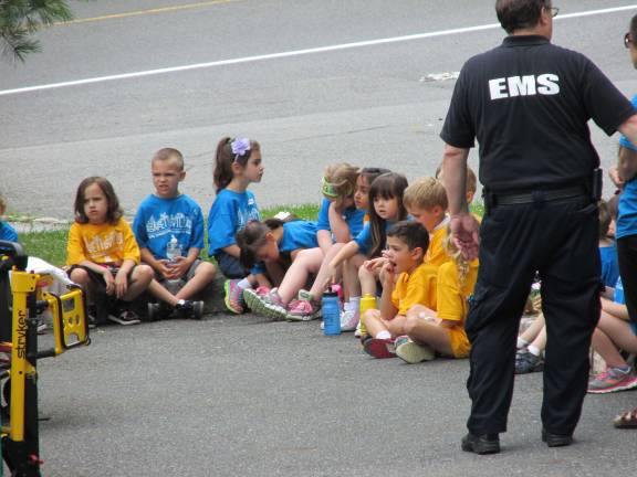 The St. Barnabas Fire House and children listening to safety tips.