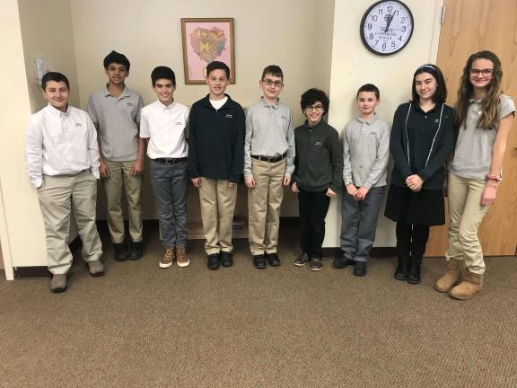 Essay contest winners, from left: David Sacks, Kanna Pasanuri, Andrew Antunes, Justin Arapkiles, Benjamin Janiszewski, William Antunes, Eamon Coletta, Caitlin Caffrey and Tija Sipols. Photo provided