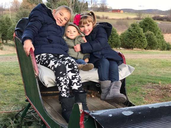 Drew Anderson with his sisters, Kayleigh (left) and Julie (right)