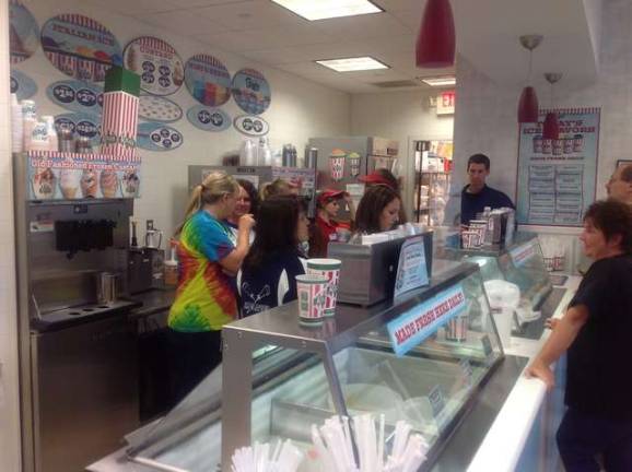 Helen Morgan School teachers and staff at Rita's work together to serve up treats. Photos by Jennifer Jean Miller.