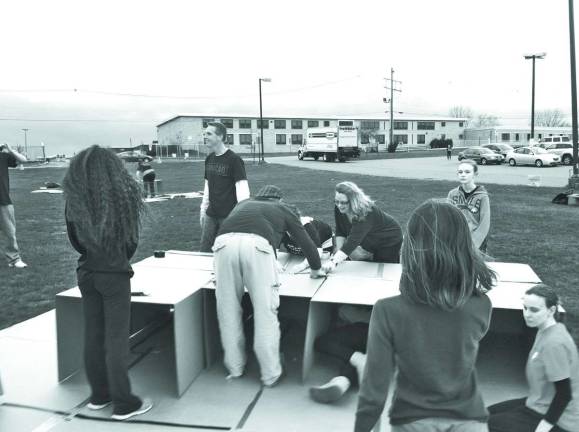 Photo courtesy of Reverend Carol Gadson of St Mary's Episcopal A group of participants prepare their boxes for the night.