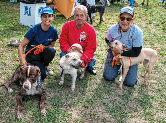 From left are Debbie Mornheinway with Evander, Ed Wsozek with Ling and Christa Collis with Sage, all of Father John’s Animal House in Lafayette.